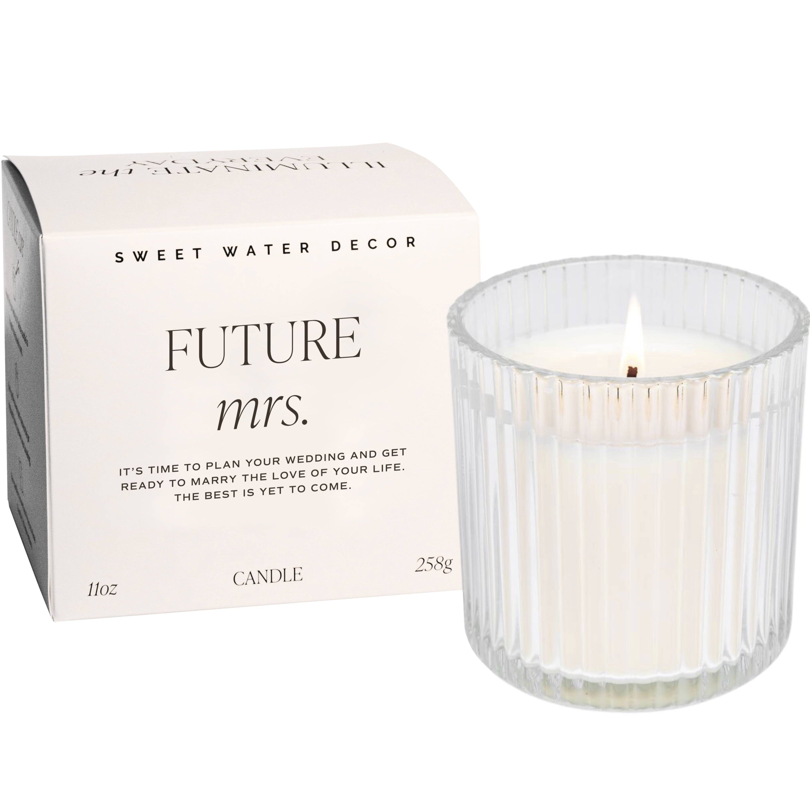 ribbed glass candle next to box that says 'FUTURE MRS.'