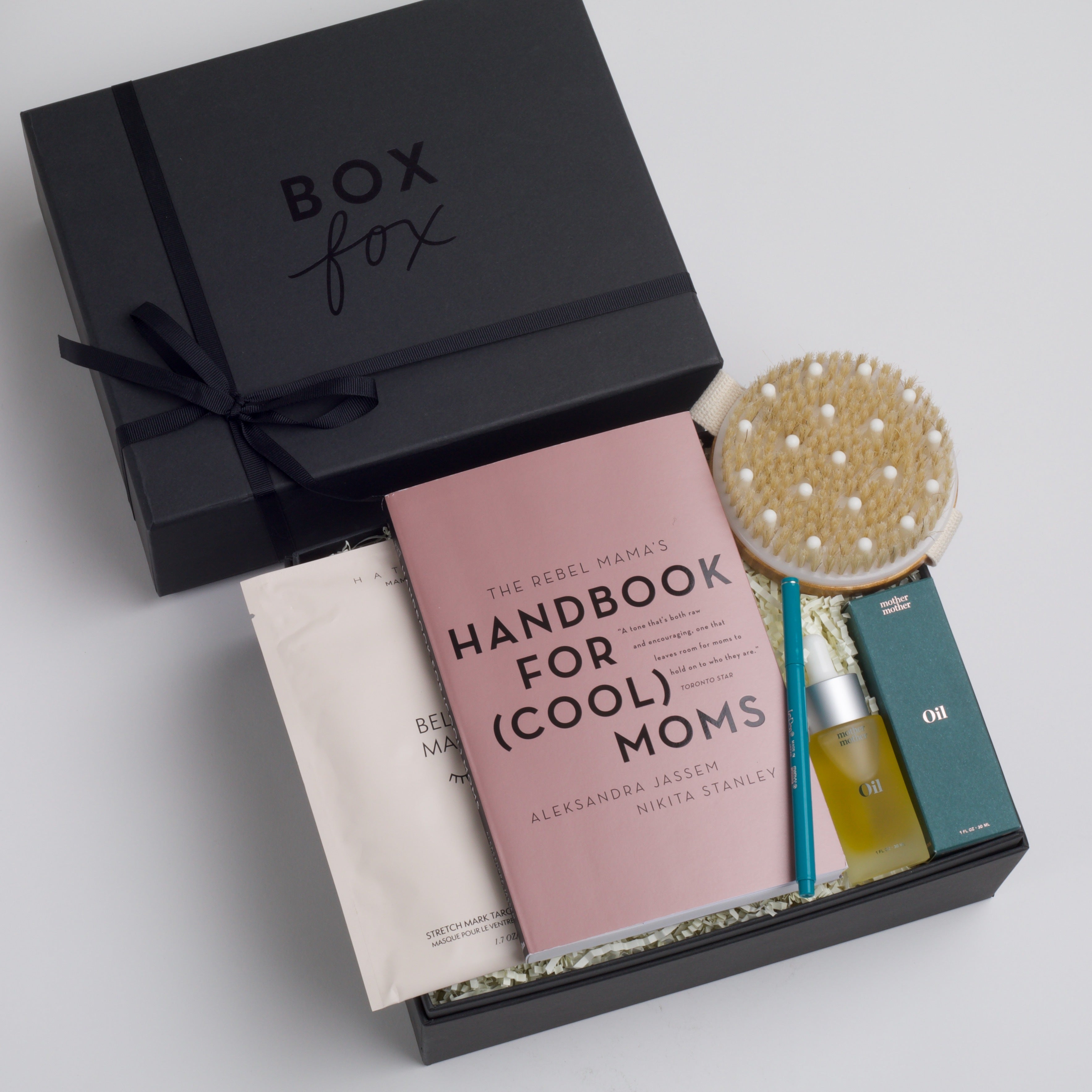 BOXFOX Gift Box filled with Handbook for (Cool) Moms, Le Pen Teal Pen, Mother Mother Belly Oil, HATCH Belly Sheet Mask, and Skön Round Dry Brush
