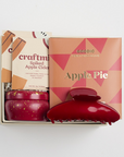 Apple pie chocolate bar, 2 spiked apple cider cocktail sachets, apple cider mini tin candle, and red claw clip packed in creme BOXFOX