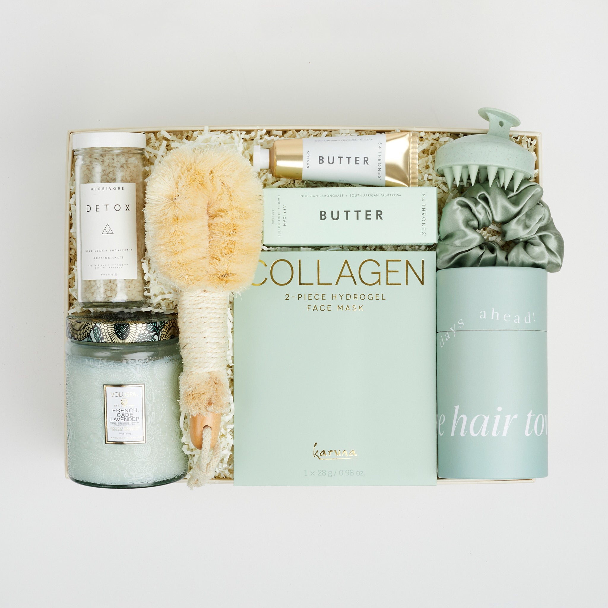 The GREEN GODDESS gift box in creme, including DETOX bath salts, large candle, dry brush, collagen face mask, hand cream, scalp scrubber, silk scrunchie and hair towel.