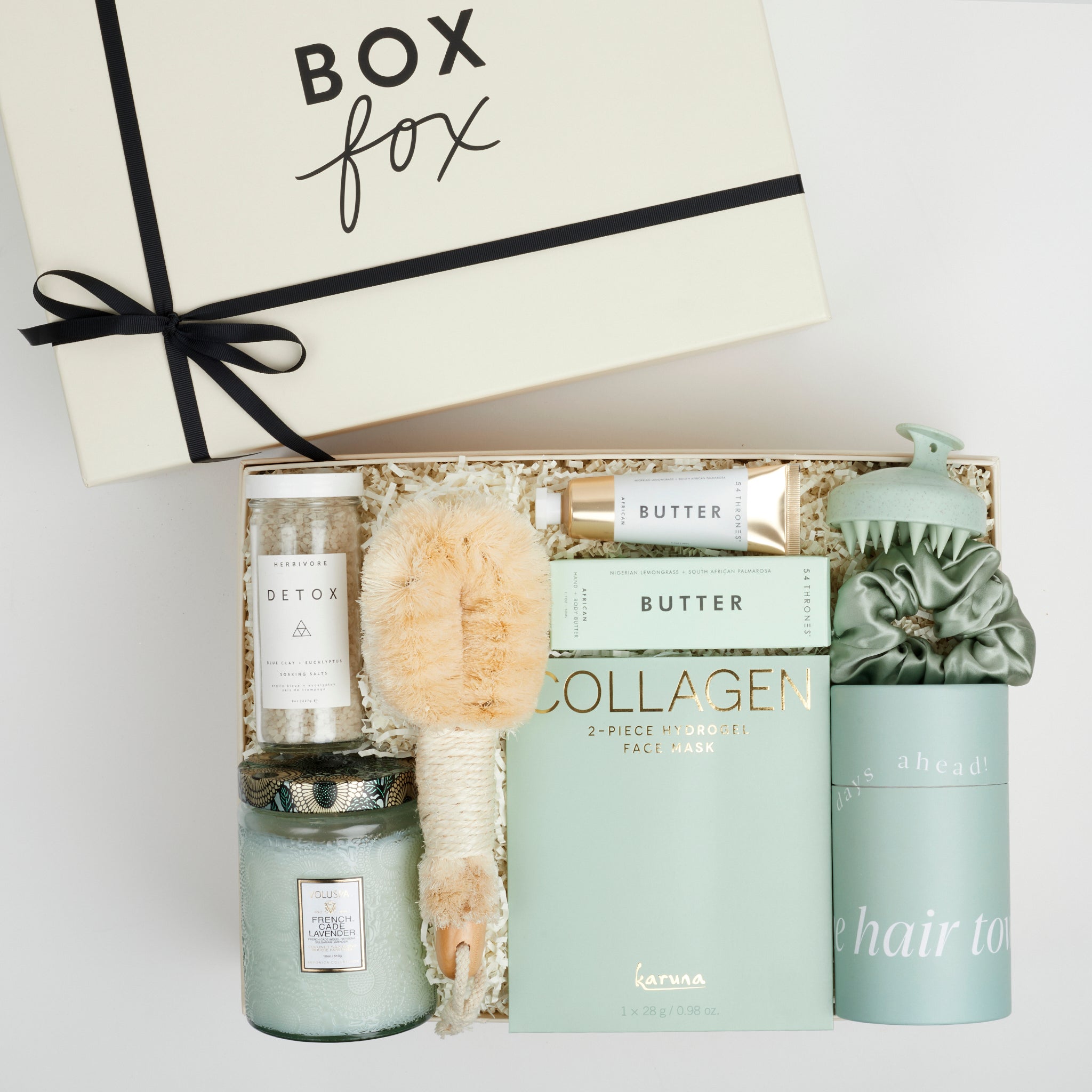 The GREEN GODDESS gift box in creme, including DETOX bath salts, large candle, dry brush, collagen face mask, hand cream, scalp scrubber, silk scrunchie and hair towel.