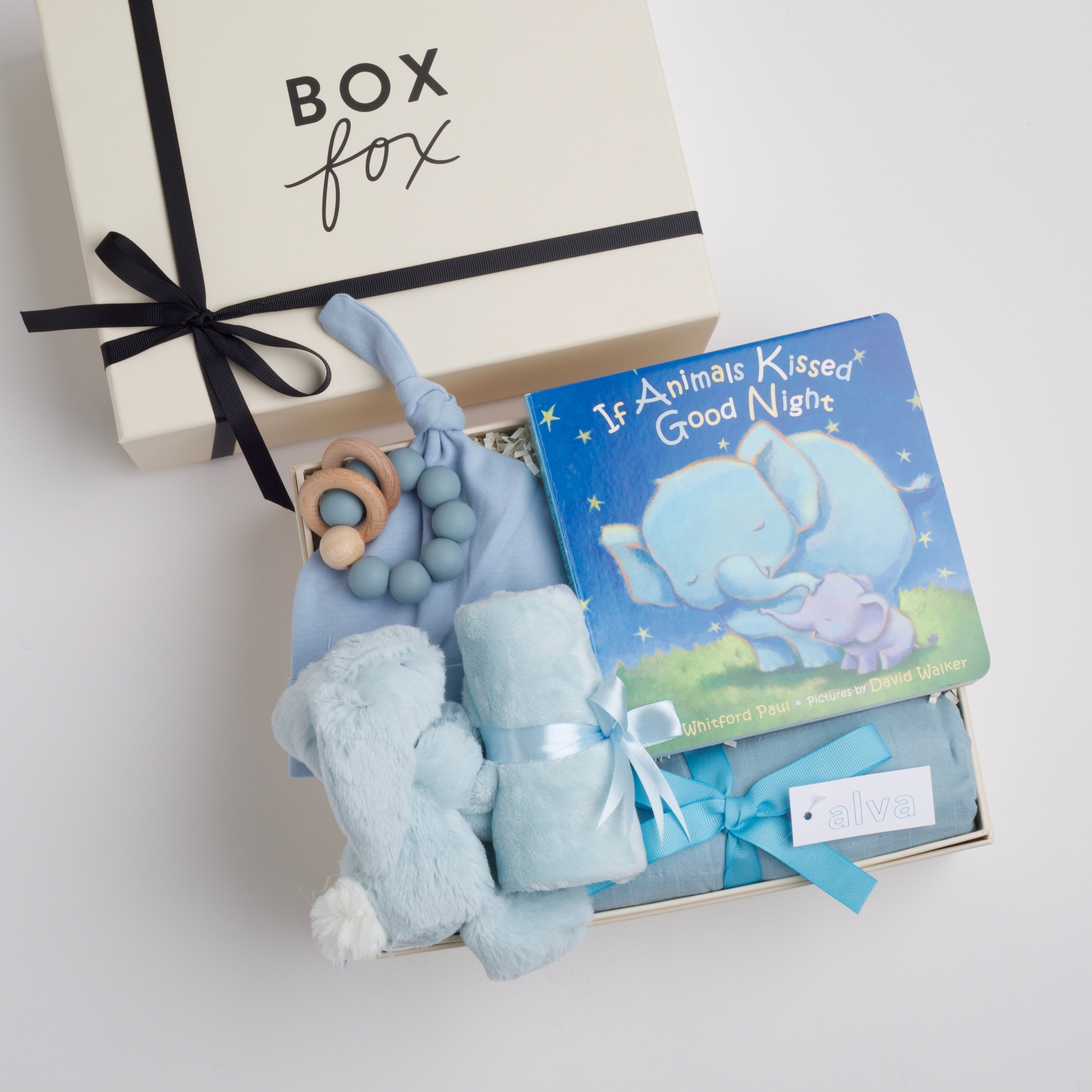 BOXFOX New Baby Boy Box including a swaddle, bunny soother, teether, hat, and book.