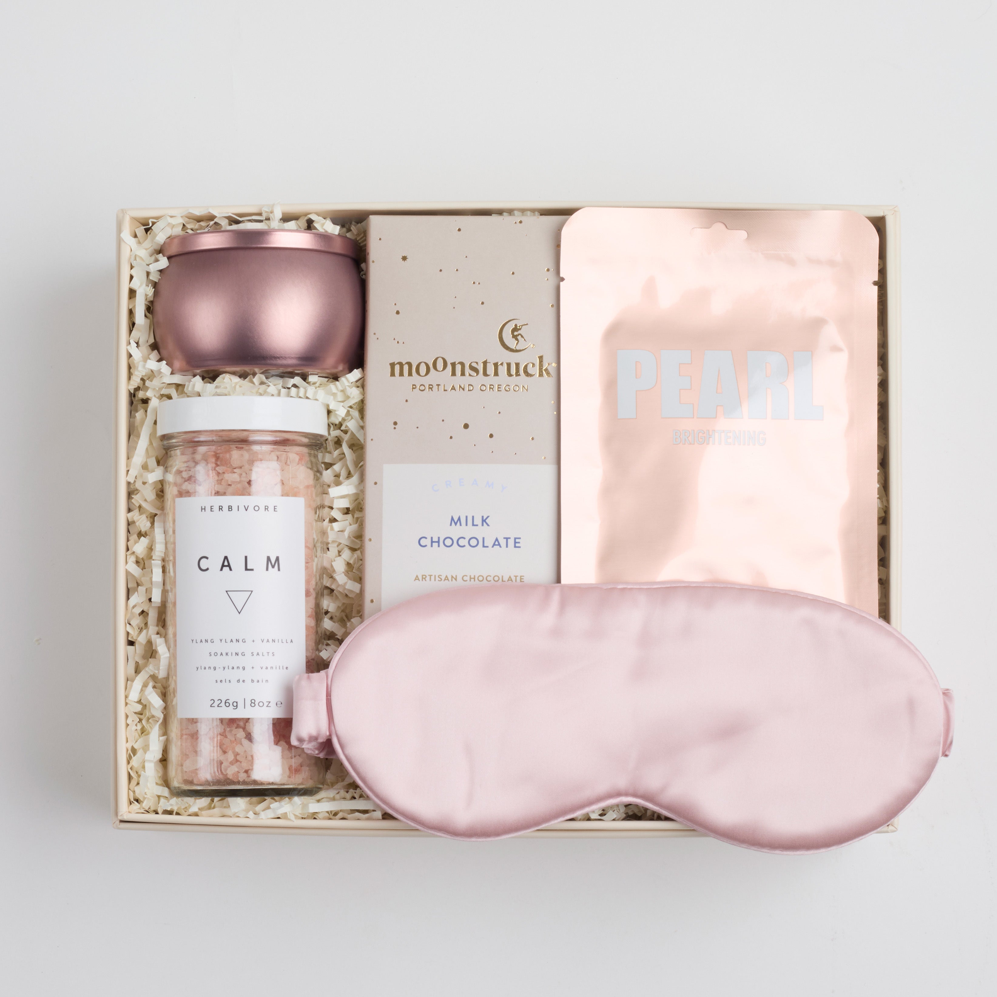BOXFOX Pink Pamper Gift Box with mini tin candle, bath salts, milk chocolate bar, sheet mask, and silk sleep mask