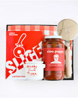 BOXFOX Black gift box packed with "Slice" Pizza book, wood pizza cutter, Ciao Pappy Marinara sauce, Pizza herbs jar and plaid red Geometry tea towel.