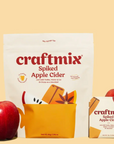Craftmix packet featured next to an apple with yellow background. The image also features the big packaging each packet is in
